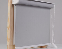 Grey material roller blinds